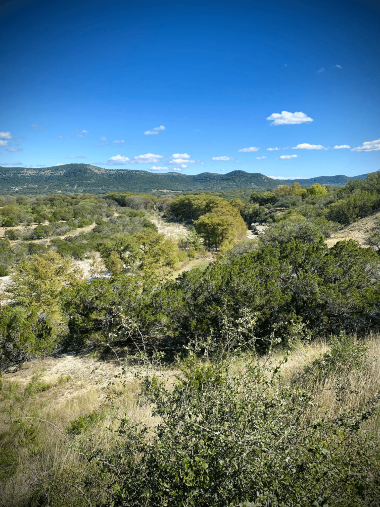 hill country landscape, where is Laura traveling