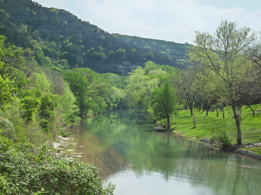 Hill Country next to the river, Where is Laura traveling