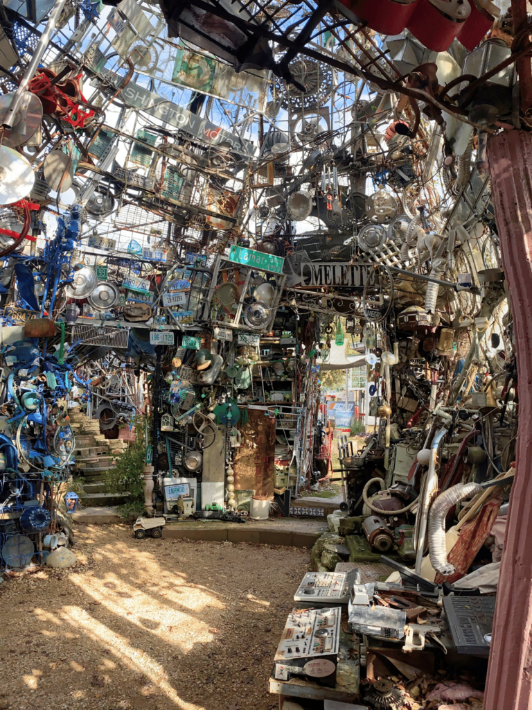 the dome inside the cathedral of junk, where is laura traveling