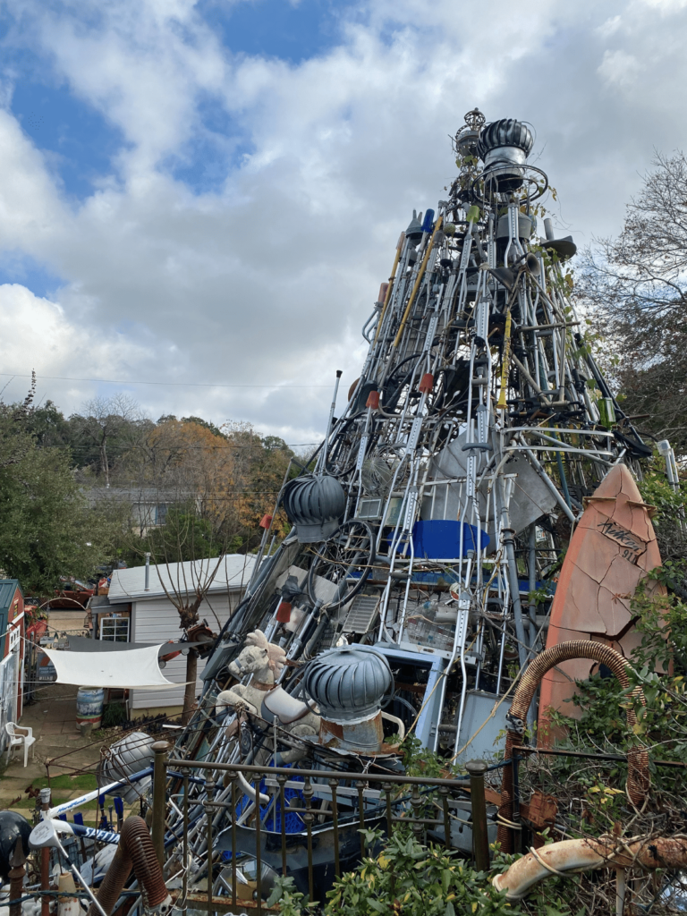 the top of the cathedral of junk, where is laura traveling