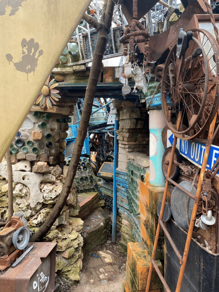 A passage in the Cathedral of Junk in Austin, Where is Laura Traveling